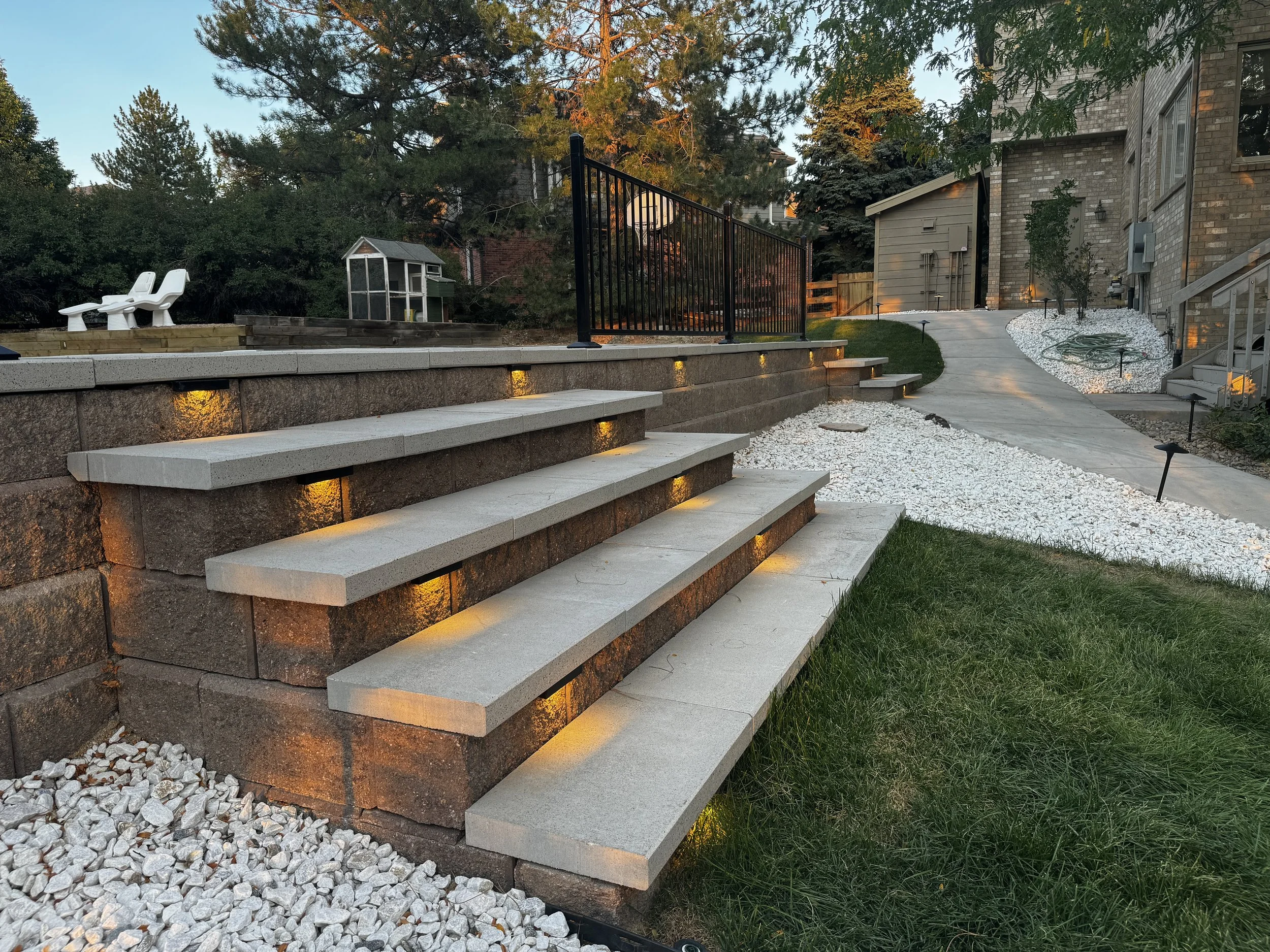 Lit Retaining Wall Steps at Dusk - Aspenwood Landscape Denver